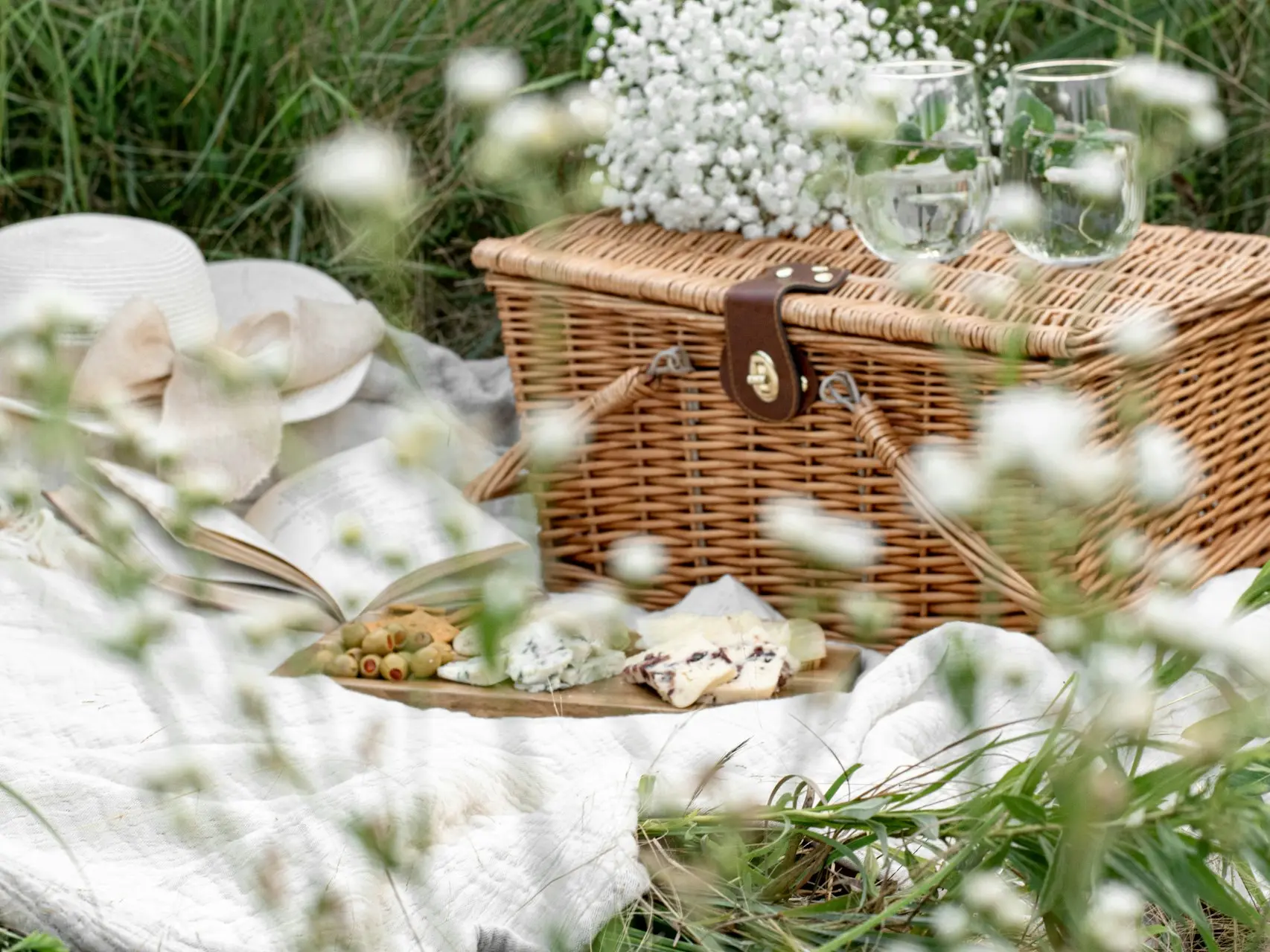 white flowers in brown woven basket